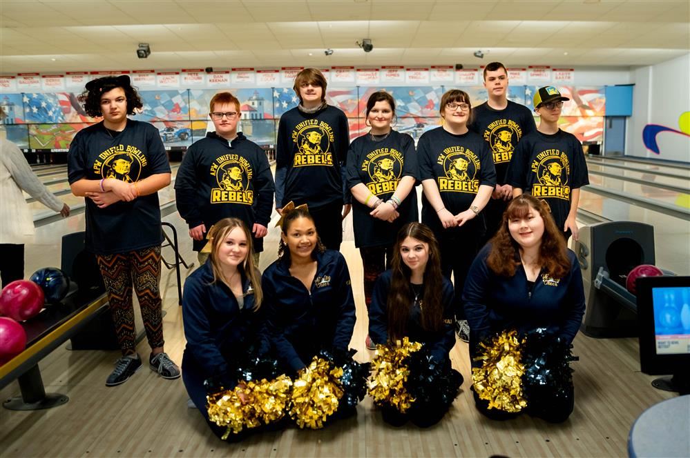  APW’s Unified Bowling Team poses with the varsity cheer team, who proudly showed their support duri